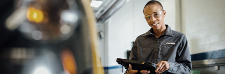 Maintenance Employee with a Device