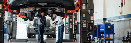 Maintenance Employees Checking the Truck